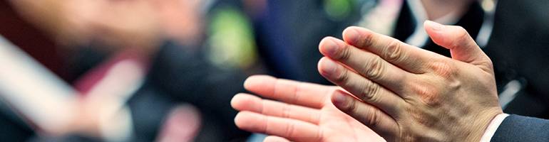 close up of a man clapping his hands