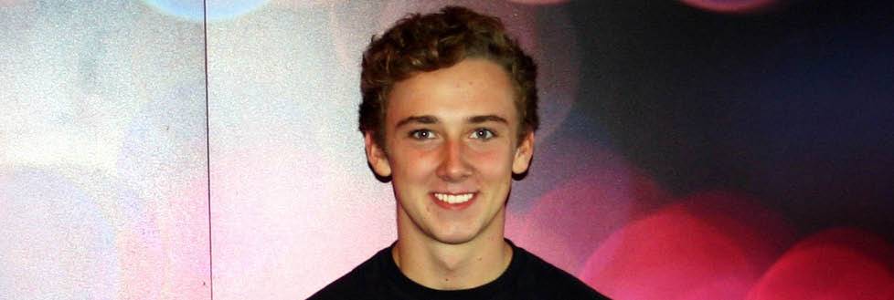 Young man stood in front of decorated background